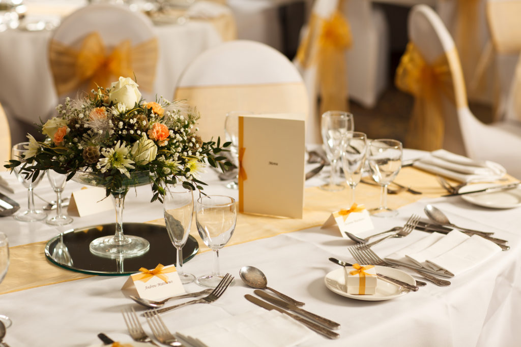 Round tables set for a wedding at Mercure Hotels